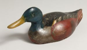 A PAINTED WOODEN DECOY DUCK, 12.5ins long.