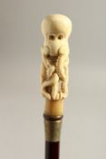 A BONE HANDLE WALKING STICK, OCTOPUS. 35ins long.
