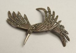 A SILVER AND MARCASITE HUMMINGBIRD BROOCH.