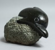 A SERPENTINE INUIT CARVING OF A DOLPHIN 4.5ins