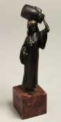 A VIENNA BRONZE OF AN ARAB GIRL CARRYING A PITCHER