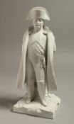 A 19TH CENTURY SEVRES RARE BISCUIT FIGURE OF NAPOLEON in military uniform, a sword at his side.