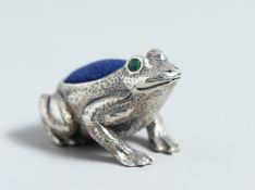 A CAST SILVER FROG PIN CUSHION.