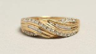 A 14CT GOLD AND DIAMOND CROSS OVER RING