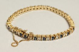 A VERY GOOD DIAMOND AND SAPPHIRE LINE BRACELET.