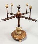 A VICTORIAN WOOD AND ALABASTER WOOL WINDER. 14ins high.