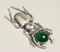 A SILVER SCARAB BROOCH
