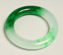 A TWO TONE JADE BANGLE