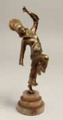 A GOOD ART DECO BRONZE DANCER on a circular stepped base.