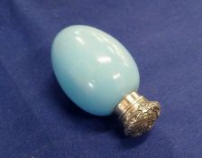 A SILVER-TOPPED EGG-SHAPED PORCELAIN PERFUME BOTTLE.