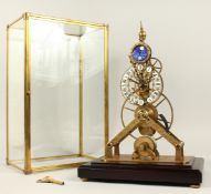 A GOOD MOONFACE SKELETON CLOCK in a glass case. 15ins high.