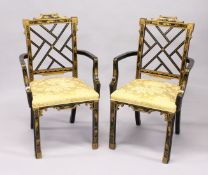 A GOOD PAIR OF CHINESE DESIGN LACQUERED CHAIRS with cross rail splats and padded seats.