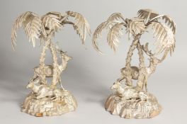 A GOOD PAIR OF PLATE BAMBOO AND DEER ORNAMENTS. Two deer beneath palm trees. 9ins high