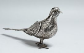 A SMALL SILVER PHEASANT with detatchable head. 9ins high.