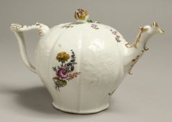 A GOOD MEISSEN BULLET SHAPED TEAPOT, CIRCA.1820, with flowers in relief and painted with flowers.