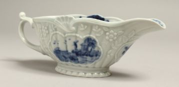 A SAMPSON BLUE AND WHITE 18TH CENTURY WORCESTER STYLE SAUCEBOAT. 7ins long.
