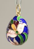 A RUSSIAN SILVER AND ENAMEL EGG PENDANT.