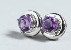 A PAIR OF SILVER AND SAPPHIRE EAR STUDS.