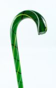 A HEAVY COLOURED GLASS WALKING STICK 36ins long.