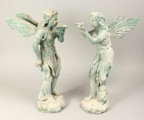A PAIR OF BRONZE FAIRIES 20ins high.