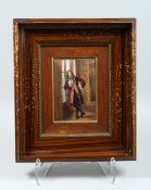 A FRAMED LIMOGES ENAMEL PLAQUE OF A STANDING MAN READING. Label on reverse V. COT LIMONGES 7 x4.