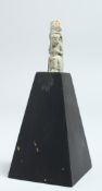 A SMALL EGYPTIAN USHABTI FAIENCE FIGURE 1.5ins high on a stand.