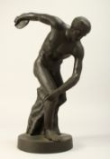 A GRAND TOUR BRONZE DISCUS THROWER on a circular base.