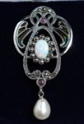 A SILVER PEARL AND RUBY BROOCH.