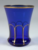 A GOOD BLUE GLASS GOBLET with gilt decoration. 4ins high
