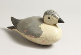 A PAINTED WOODEN BIRD. 9ins long.