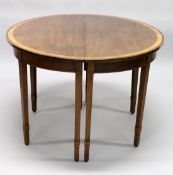 A GEORGIAN MAHOGANY AND SATINWOOD BANDED EXTENDING DINING TABLE
