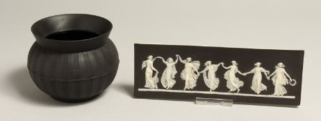 AN EARLY 19TH CENTRUY WEDGWOOD PLAQUE with black basalt layer and seven well-modelled female figures