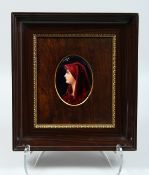 A FRAMED LINOGES ENAMEL PLAQUE, HEAD AND SHOULDERS OF A YOUNG LADY. 4.5ins x 3ins Signed and
