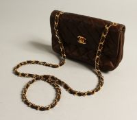 A LADIES BROWN QUILTED LEATHER SHOULDER BAG
