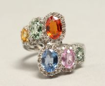 A GOOD 18CT GOLD MULTI COLOURED SAPPHIRE RING
