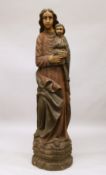 A LARGE AND IMPRESSIVE RELIGIOUS CARVED AND PAINTED MADONNA AND CHILD, standing on a naturalistic