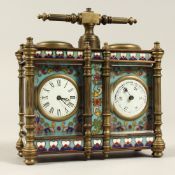 A DOUBLE BRASS AND CLOISONNE ENAMEL CLOCK