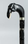 A CEYLONESE EBONY WALKING STICK with elephant handle 31ins long.