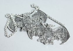 A PAIR OF WHITE METAL BRANDY & WHISKY LABELS