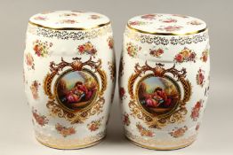 A PAIR OF CHINESE ROSE PORCELAIN BARREL SEATS flowers and birds. 18ins high.