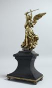 A 19TH CENTURY GILT BRONZE FIGURE OF A WINGED FIGURE, probably St. Michael. standing on an
