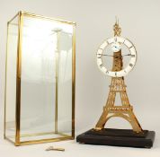 A GOOD EIFFEL TOWER SKELETON CLOCK in a glass case. 22ins high.