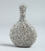 A CHINESE WHITE METAL EMBOSSED PERFUME BOTTLE