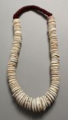 A TRIBAL SHELL NECKLACE.