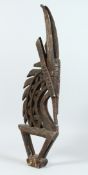 AN AFRICAN CARVED WOOD GOAT FIGURE 30ins long.