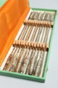 A BOXED SET OF TWELVES SKEWERS with silver plated handles 14ins long