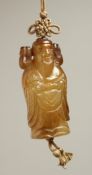 A CARVED JADE GOLD PENDANT. 2.25ins long.