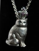 A SILVER CAT WITH CROWN PENDANT AND CHAIN.