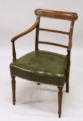 A GOOD GEORGE III MAHOGANY ARM CHAIR with leather seat and turned legs.