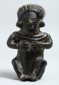 A SOUTH AMERICAN POTTERY SEATED ANTIQUITY 6ins.